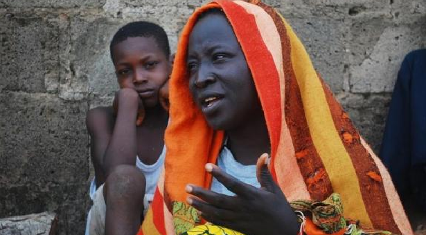 A woman talks about her escape from violence after Boko Haram insurgents attacked their community at the internally displaced persons (IDP) camp at Wurojuli, Gombe State