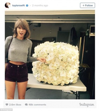2-Taylor Swift with flower arrangement sent to her by Kanye West - THEWILL NEWS MEDIA