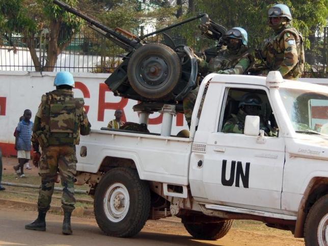 U.N. peacekeepers take a break as they patrol along a street during the presidential election in Bangui CAR