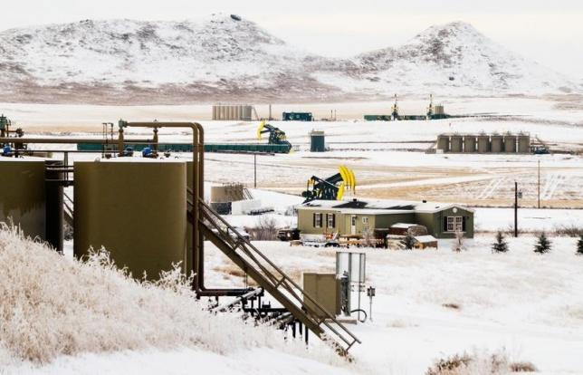Pumpjacks and other infrastructure for producing oil dot fields outside of Watford City, North Dakota