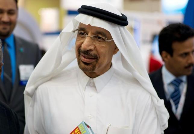Khalid al-Falih speaks to the media at the company's booth during Petrotech 2014 in Manama