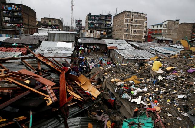 A general view shows rescue workers searching for residents feared trapped in the rubble of a six-storey building that collapsed after days of heavy rain in Nairobi