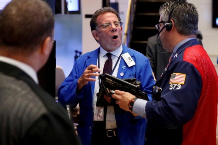 Traders work on the floor of the New York Stock Exchange (NYSE) shortly after the opening bell in New York