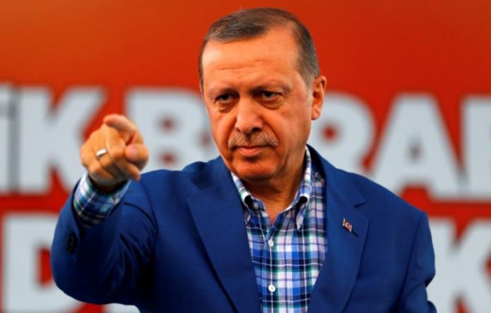 Turkey's President Tayyip Erdogan points at the United Solidarity and Brotherhood rally in Gaziantep