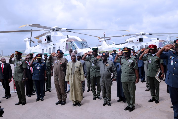 TWO PRESIDETIAL HELICOPTERS DONATED TO AIRFORCE - THEWILL NEWS MEDIA FGN DONATES TWO PRESIDENTIAL HELICOPTERS . Minister of Defence, Brig General Mansur Dan-Ali (M) flanked by service Chiefs as two Presidential Helicopters been handed over to the Nigerian Airforce at the Presidential wing of Nnamdi azikwe International Airport in Abuja. PHOTO; SUNDAY AGHAEZE. OCT 10 2016