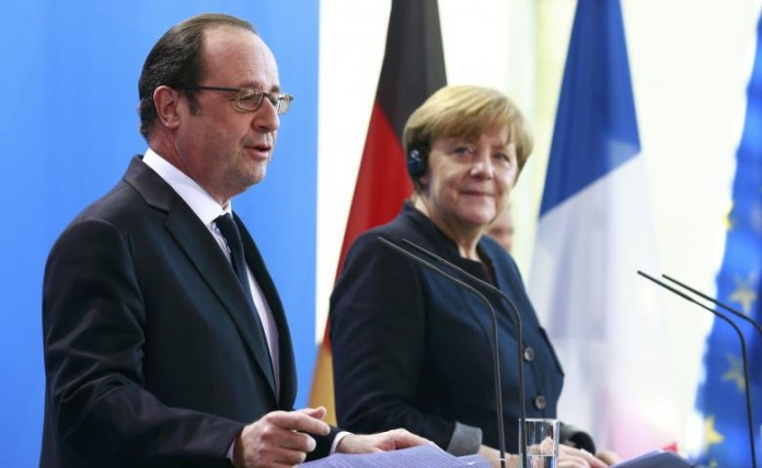 German Chancellor Merkel and French President Hollande address the media at the Chancellery in Berlin