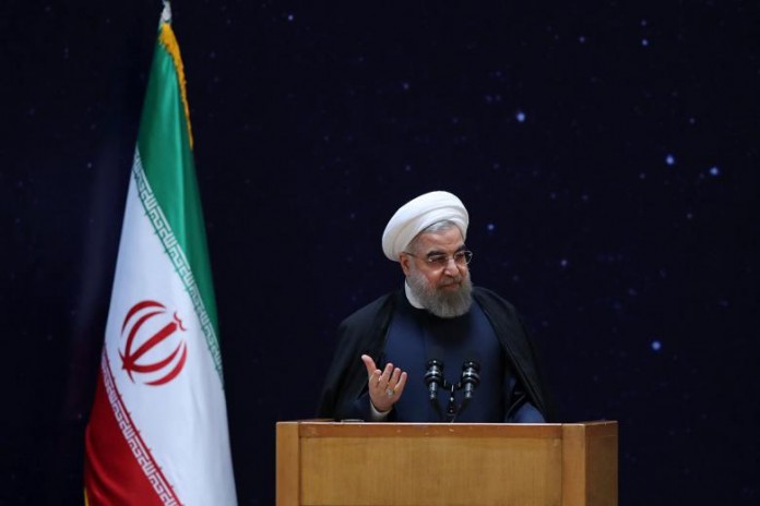 Iran's President Hassan Rouhani gestures as he speaks during a ceremony marking National Day of Space Technology in Tehran