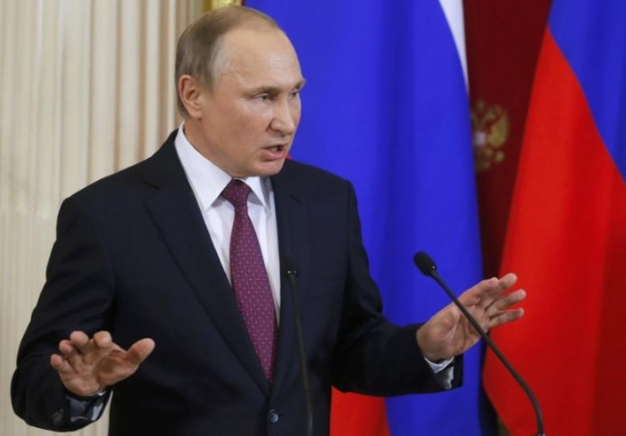 Russian President Putin speaks during a news conference in Moscow