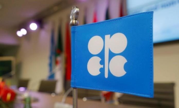 FILE PHOTO - A flag with the OPEC logo is seen before a news conference in Vienna FILE PHOTO - A flag with the Organization of the Petroleum Exporting Countries (OPEC) logo is seen before a news conference at OPEC's headquarters in Vienna, Austria, December 10, 2016. REUTERS/Heinz-Peter Bader/File Photo