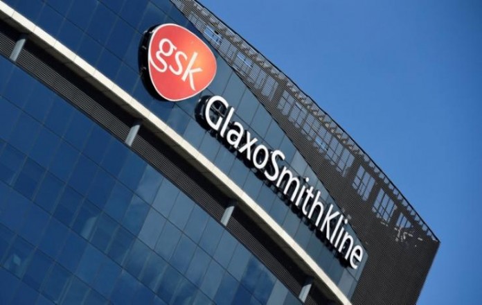 FILE PHOTO: Signage for GlaxoSmithKline is seen on its offices in London