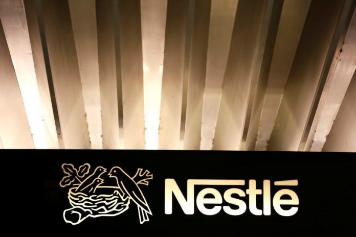 The Nestle logo is pictured on the company headquarters entrance building in Vevey
