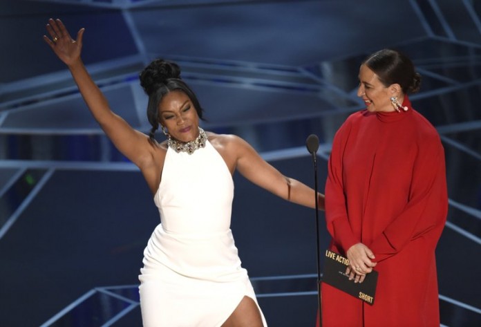 Tiffany Haddish makes Oscars fashion moment with used dress
