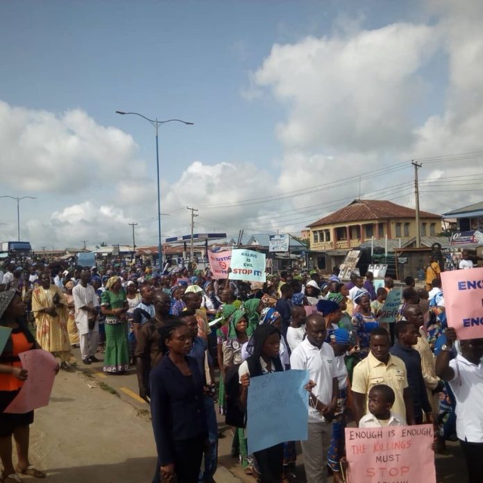 Catholics Hold Mass Processing