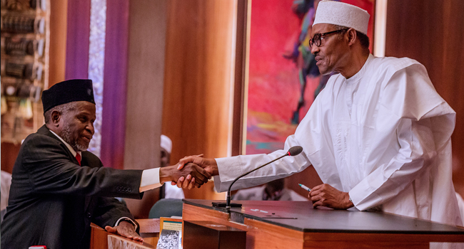 Acting-CJN-Justice-Ibrahim-Tanko-Mohammed-in-a-handshake-with-President-Buhari