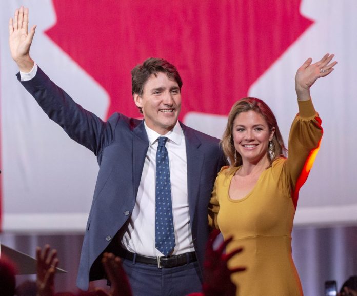 Justin Trudeau celebrates with his wife, Sophie Gregoire Trudeau, after winning a minority government at the election night headquarters on Tuesday in Montreal. Ryan Remiorz/The Canadian Press via AP
