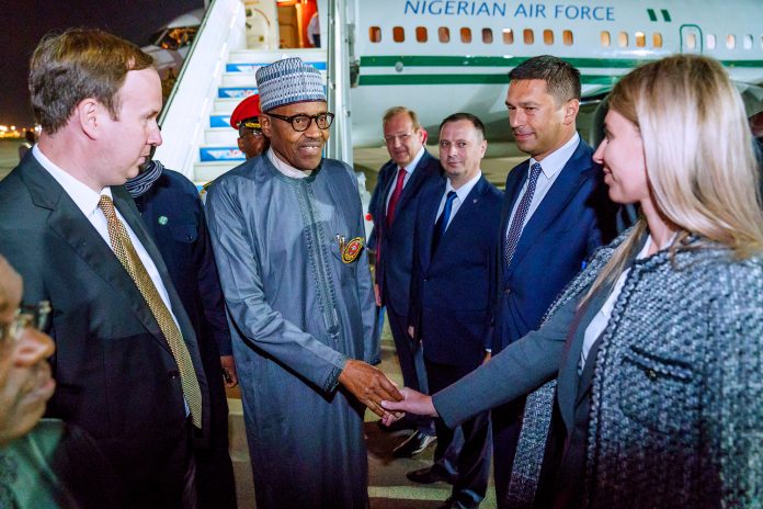 Russia 2 Buhari is received by a delegation of Russians in Sochi.