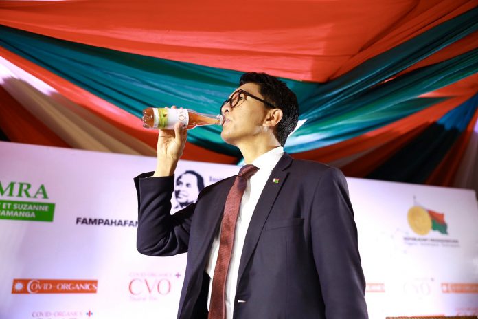 Madagascar president Andry Rajoelina unveils a local herbal remedy