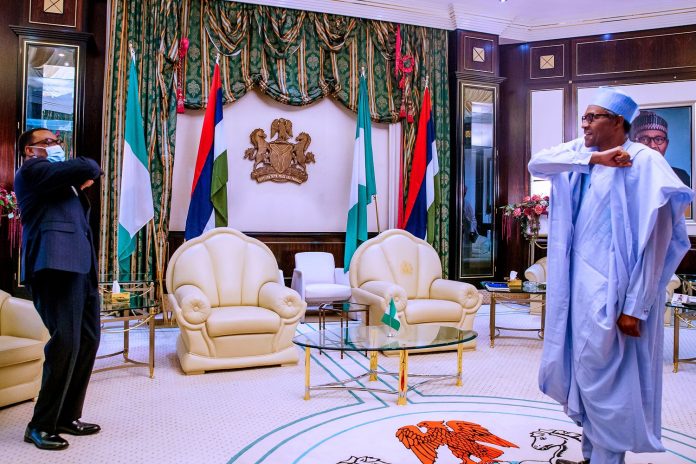 Buhari Says Stands Solidly Behind AfDB President Adesina 3