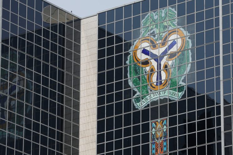 Central Bank of Nigeria's logo is seen on the headquarters building in Abuja - THEWILL NEWS MEDIA Central Bank of Nigeria's logo is seen on the headquarters building in Abuja, Nigeria January 22, 2018. REUTERS/Afolabi Sotunde - RC1D90C799D0