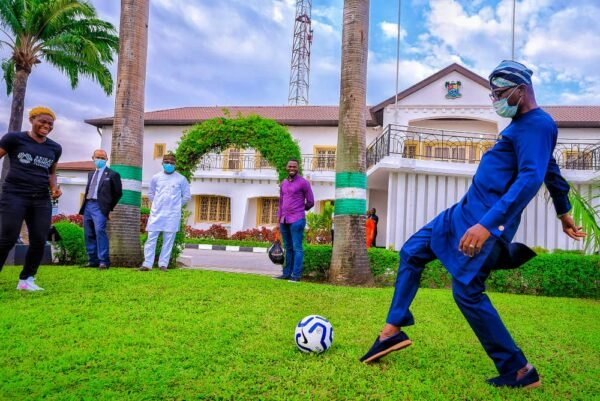 Sanwo-Olu Displays Football Skills As Barcelona Star Oshoala Visits