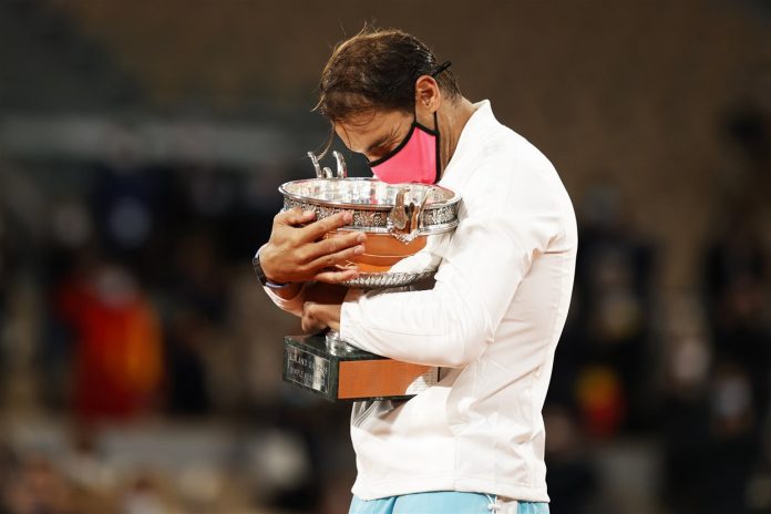 -rafael-nadal-trophy-Rafael Nadal hugs his trophy after winning the French Open against Novak Djokovic on Oct. 11, 2020.Christian Hartmann : Reuters