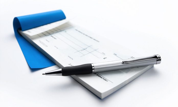 cheque book and pen. Image shot 2007. Exact date unknown.