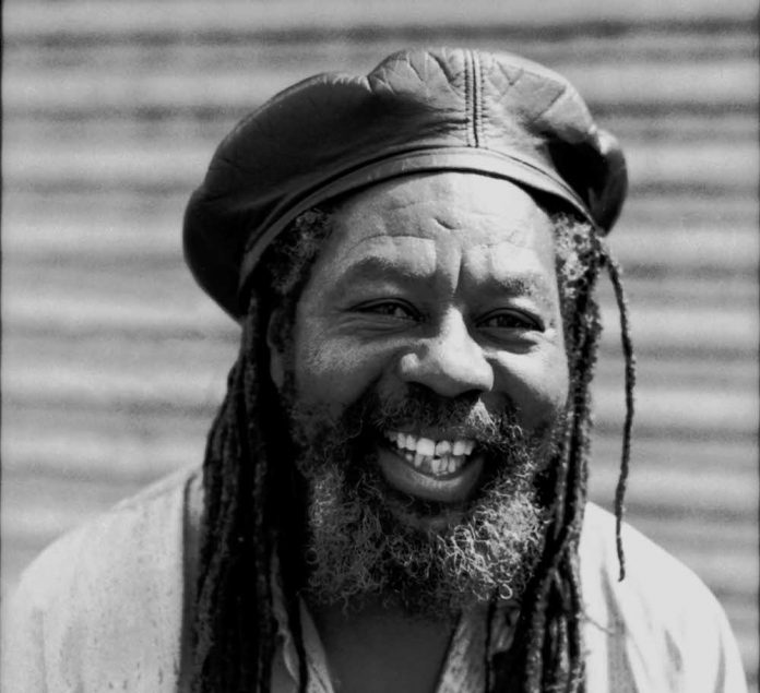Photo of U ROY U-Roy outside Ariwa Records, London