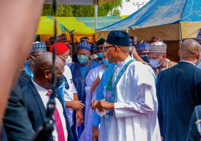 buhari removes face mask
