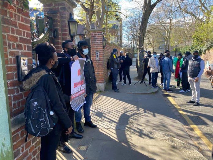 Ex_PvfGWQAYS8_o Nigerians in UK today stormed Abuja House in London, protesting and demanding Buhari must return back to Nigeria