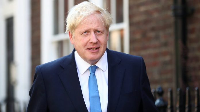 Boris Johnson is seen outside his office in London Boris Johnson