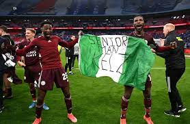 Nigerians winning a trophy