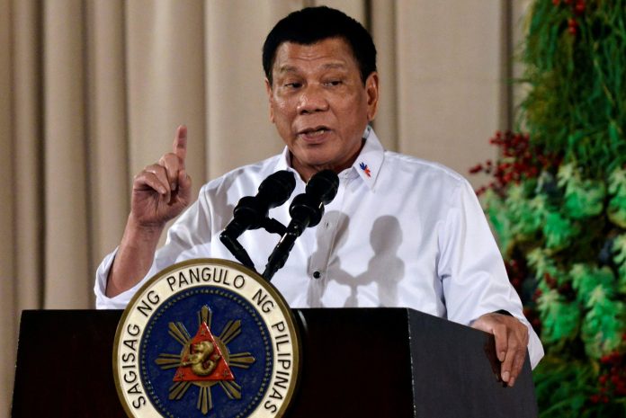 Image: Philippine President Rodrigo Duterte looks on during an awarding ceremony for outstanding Filipinos and organizations overseas, at the Malacanang Palace in Manila Philippines President Rodrigo Duterte