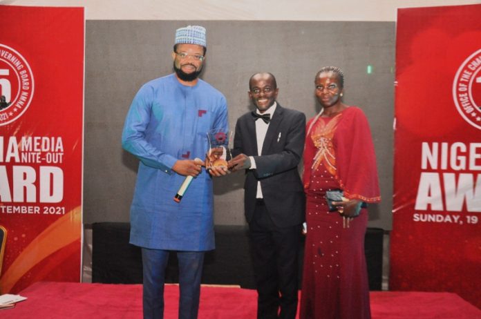 L-R: Attai Oguche - Marketing Manager, TECNO Nigeria; Anthony Awunor, winner of the Nigeria Media Nite-Out Award (NMNA) Aviation Writer of The Year 2021 and wife, Mrs Ijeoma Awunor during the award presentation at the Lagos Airport Hotel on the 19th, September, 2021.