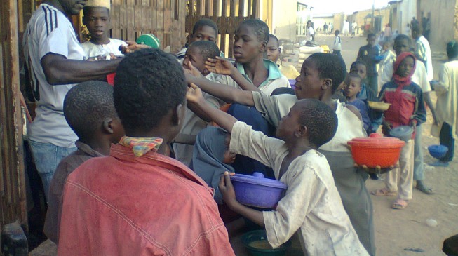 Hungry children vying for food