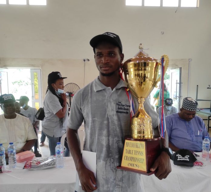 Male Champion, Akanbi Rilwan, with his trophy