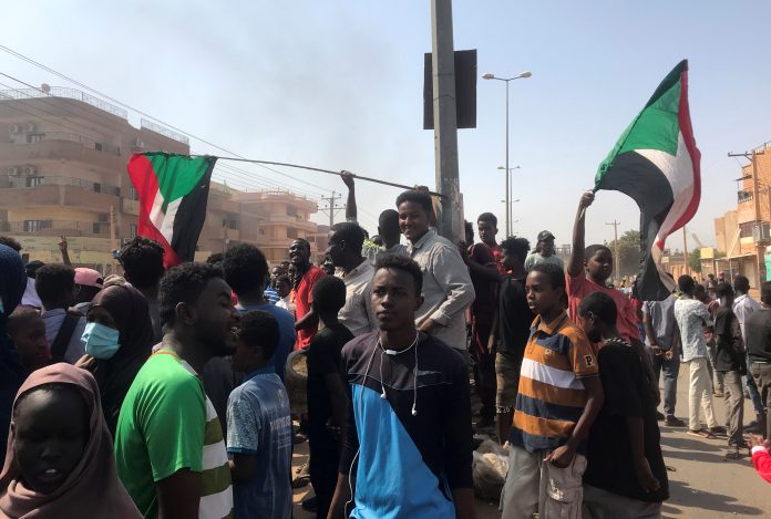 Protesters block a road in Khartoum Protesters