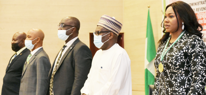 Representative of the Executive Chairman, Federal Inland Revenue Service, Mr Iro Ukpai; representative of the Accountant-General of the Federation, Mr Salawu Zubair; Vice President, Chartered Institute of Taxation of Nigeria (CITN), Mr Samuel Agbeluyi; Executive Chairman of the FCT Internal Revenue Service, Alhaji Abdullahi Attah and Chairman, CITN, Abuja and District Society, Mrs Clara Nnachi, during the Chartered Institute of Taxation of Nigeria 2021 Tax Week in Abuja on Thursday (14/10/21).