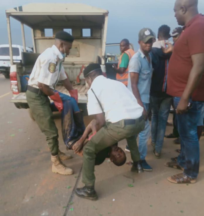 Trace officials carrying one of the victims