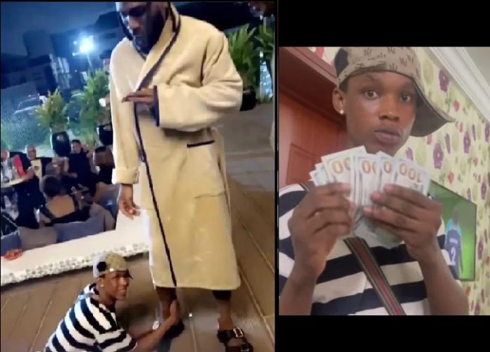 Burna Boy Gifts $3000 To Upcoming Singer Who Grabbed His Feet In Viral Video Burna Boy Gifts $3000 To Upcoming Singer Who Grabbed His Feet In Viral Video