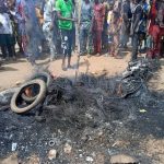 Angry Youth Kill, Set Ablaze Corpses of Ritualists With Fresh Human Head In Ogun Angry Youth Kill, Set Ablaze Corpses of Ritualists With Fresh Human Head In Ogun