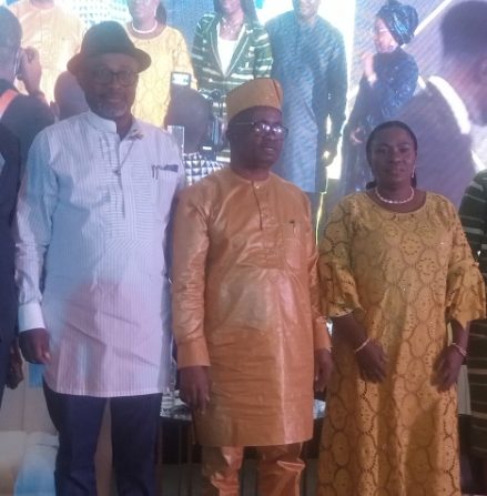 Mr Johnson Awoyomi, outgoing Managing Director, National Engineering and Technical Company flanked by his wife, Nike and Mr Simbi Wabote, Executive Secretary, Nigerian Content Development and Monitoring Board during his book launch on Saturday in Lagos.