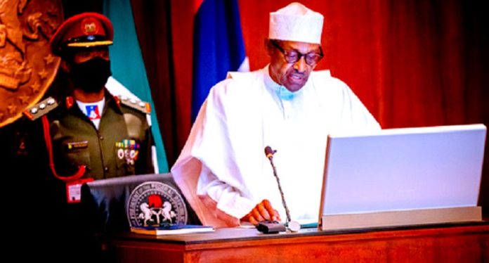 Buhari signs Buhari signs