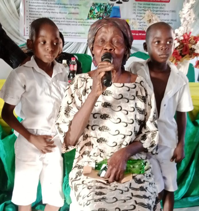 Madam Bassey Ekong and two of her grandchildren Madam Bassey Ekong and two of her grandchildren