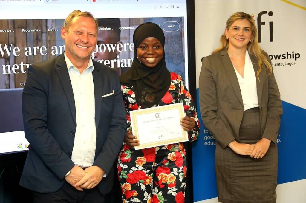 L-R U.S. Consulate Public Affairs Officer Stephen Ibelli, 2021 CYFI Fellow Rafiat Atanda with CYFI Mentor_U.S. Consulate Political Officer Briana Olson, during the graduation ceremony - THEWILL NEWS MEDIA