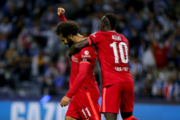 FC Porto v Liverpool FC - Group B - UEFA Champions League PORTO, PORTUGAL - SEPTEMBER 28: (BILD OUT) Mohamed Salah of Liverpool FC and Sadio Mane of Liverpool FC celebrates after scoring his team's first goal during the UEFA Champions League group B match between FC Porto and Liverpool FC at Estadio do Dragao on September 28, 2021 in Porto, Portugal. (Photo by Diogo Cardoso/DeFodi Images via Getty Images)