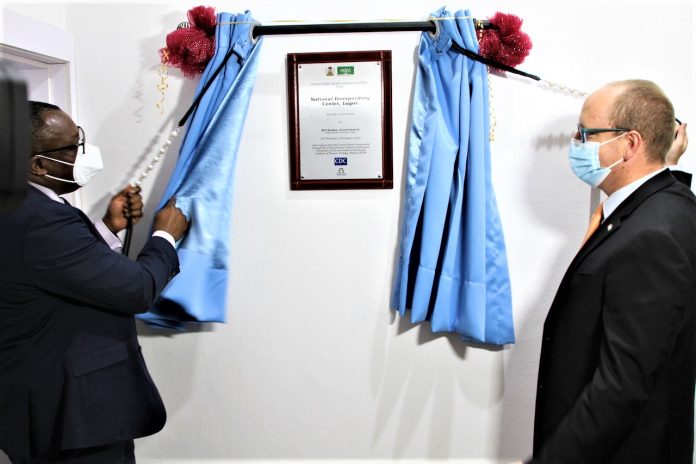 9C989CE2-2737-49B1-97E3-14169AD42045 Director General, Nigeria Center for Disease Control, Dr. Ifedayo Adetifa, (left) with United States Consul General Will Stevens during the commissioning of a U.S. funded biorepository at the NCDC Public Health Laboratory in Yaba, Lagos