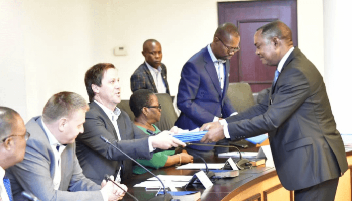 Julius Berger MD of Julius Berger Nigeria Plc, Engr. Dr. Lars richter, when he earlier received the signed contract documents for the 11th and 12th flyovers from the Hon. Attorney General and Comm. For Justice of Rivers State, Prof. Zacchaeus Adangor, SAN in Port Harcourt.