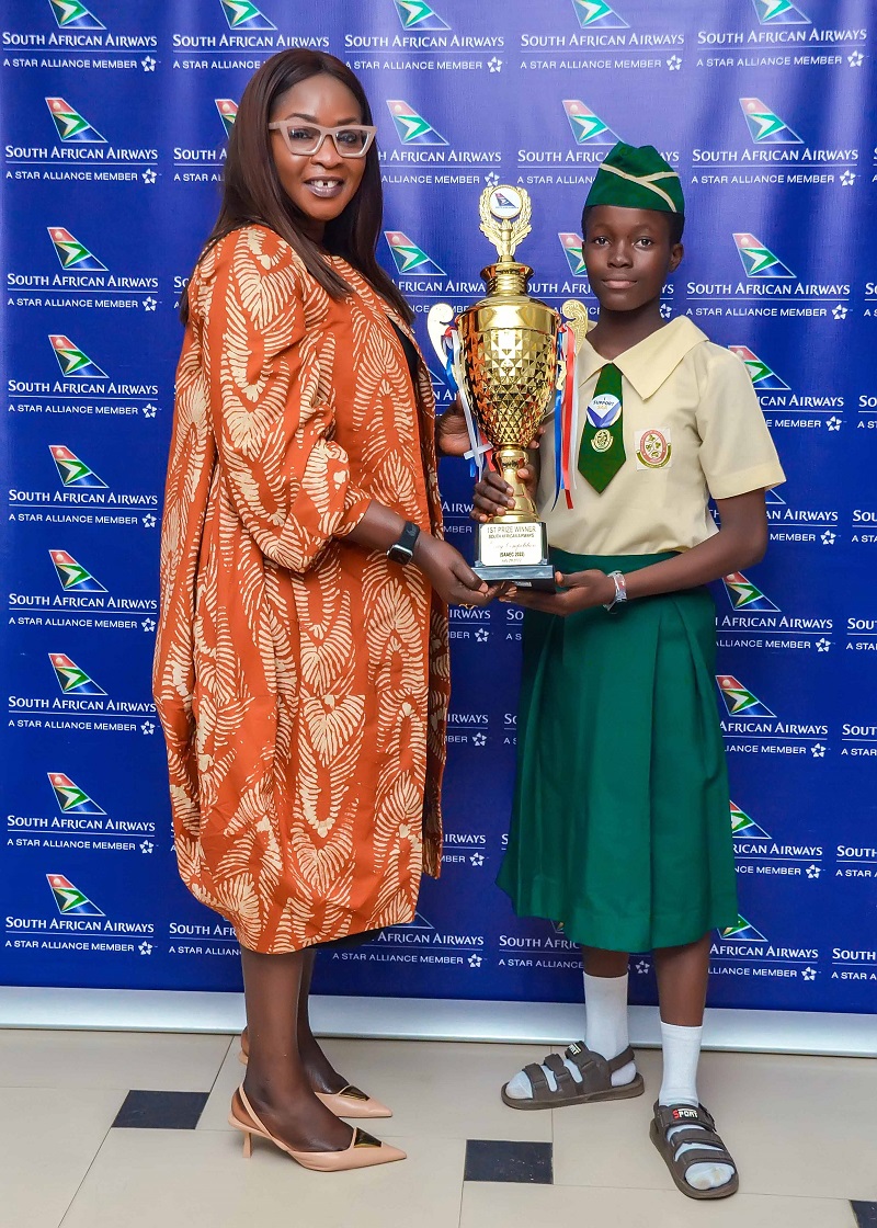 NGWAOGU IFEOLUWA UGOCHI - THEWILL NEWS MEDIA Mrs. Kemi Leke-Bamtefa, Country Manager, South African Airways, presenting the trophy to Miss Ngwaogu Ifeoluwa Ugochi of Abesan Senior High School, Ipaja, Winner of the 3rd South African Airways Essay Competition (SAAEC 2022).