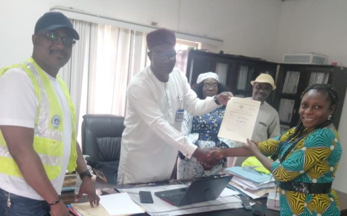 The General Manager, Operations, Licensing and Training Standards, (DOLTS), Engr. Haruna Hyelni presenting ATO certificate to the Accountable Manager/Chief Executive Officer, Aviatrix Hub, Mrs. Victoria Adegbe on behalf of the Director General of NCAA , Capt. Musa Nuhu recently in Abuja.