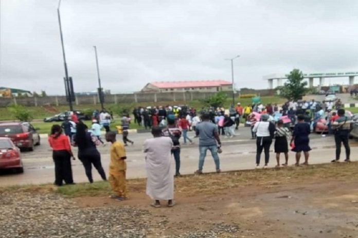 Students block lagos airport road